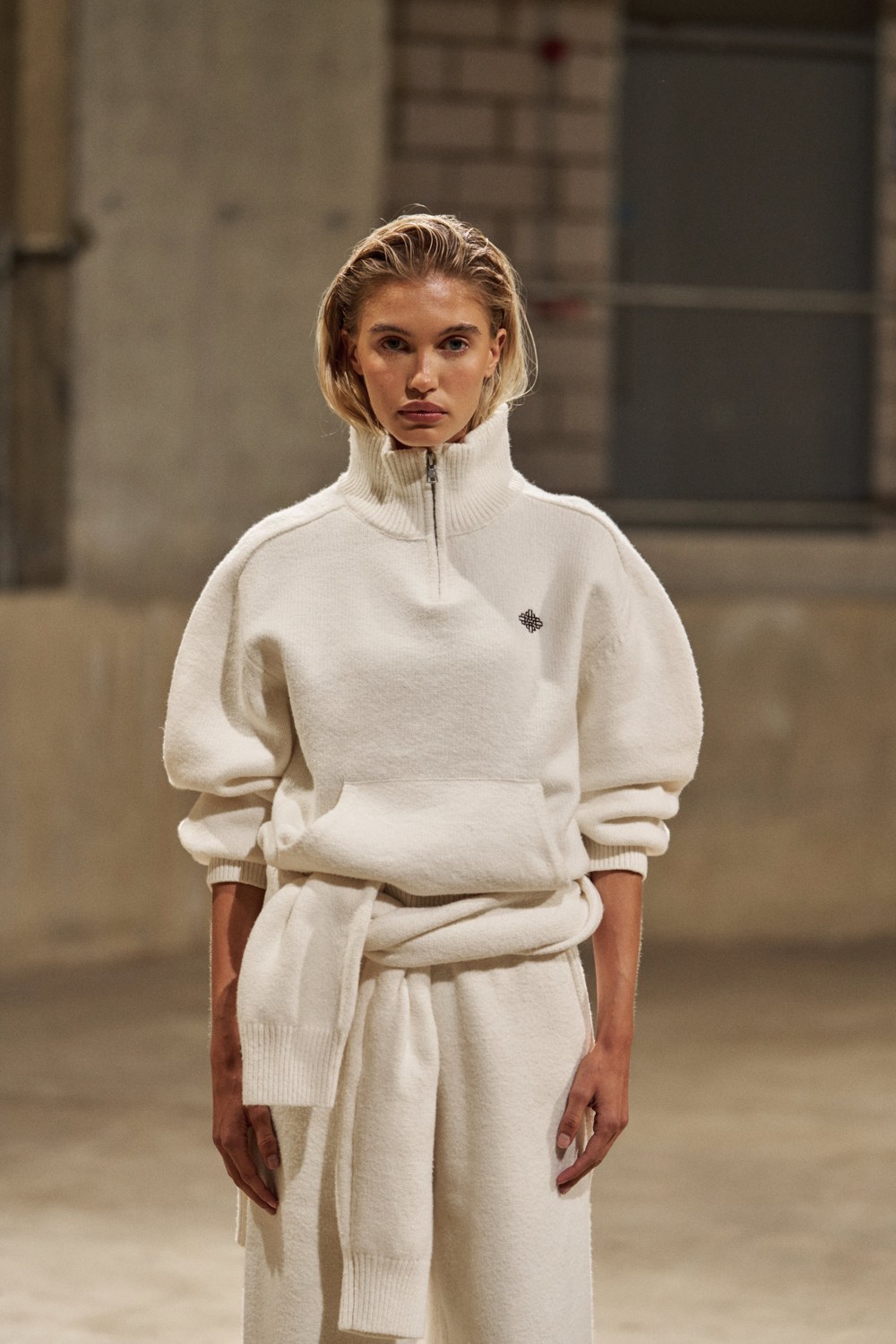 The Couture Club campaign: cream quarter-zip sweatshirt and matching relaxed trousers